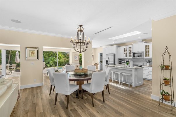 Chandelier, Dining room, Interior, Kitchen, Recessed Lighting, Stainless Steel Appliances, Wood Texture Flooring
