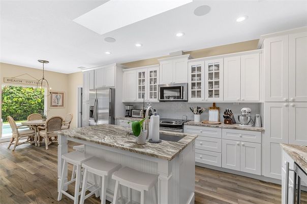 Dining room, Interior, Kitchen, Pendant Lights, Recessed Lighting, Stainless Steel Appliances, Wood Texture Flooring