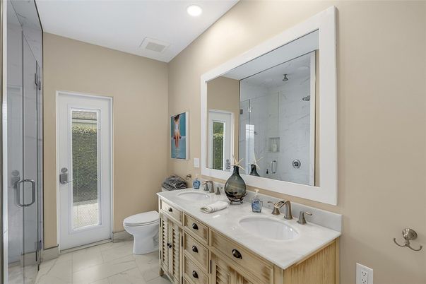 Bathroom, Dual Sink Vanities, Glass Shower, Interior, Marble, Marble Walls, Recessed Lighting