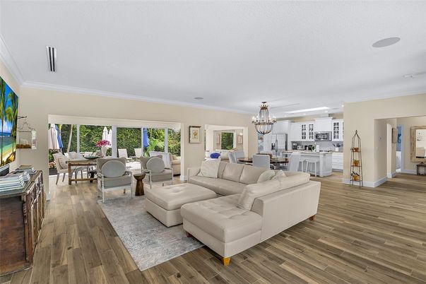 Chandelier, Dining room, Fireplace, Interior, Kitchen, Living room, Pendant Lights, Wood Texture Flooring