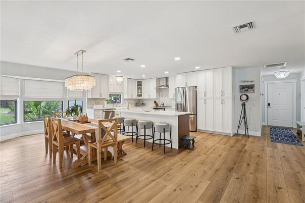 Chandelier, Dining room, Interior, Kitchen, Recessed Lighting, Stainless Steel Appliances, Wood Texture Flooring