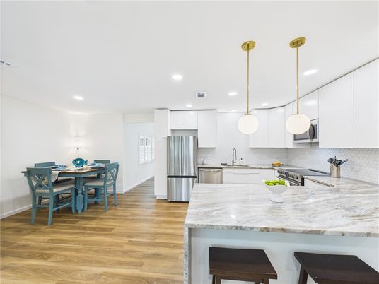 Dining room, Interior, Kitchen, Pendant Lights, Recessed Lighting, Stainless Steel Appliances, Wood Texture Flooring