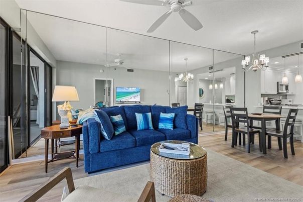 Chandelier, Dining room, Interior, Kitchen, Living room, Pendant Lights, Stainless Steel Appliances, Wood Texture Flooring
