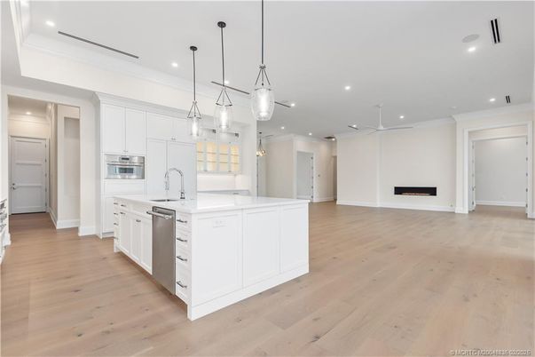 Fireplace, Interior, Kitchen, Pendant Lights, Recessed Lighting, Stainless Steel Appliances, Wood Texture Flooring