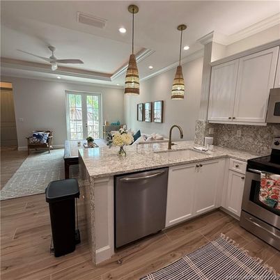 Interior, Kitchen, Pendant Lights, Recessed Lighting, Stainless Steel Appliances, Wood Texture Flooring