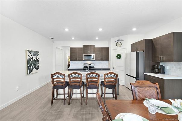 Dining room, Interior, Kitchen, Recessed Lighting, Stainless Steel Appliances, Wood Texture Flooring