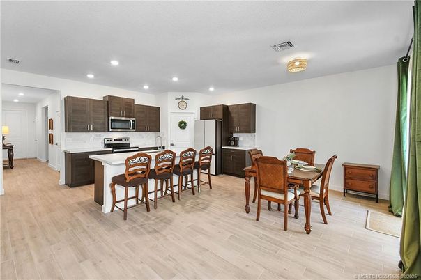 Dining room, Interior, Kitchen, Recessed Lighting, Stainless Steel Appliances, Wood Texture Flooring