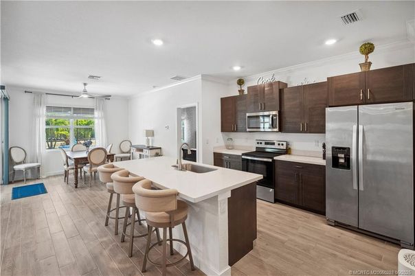 Dining room, Interior, Kitchen, Recessed Lighting, Stainless Steel Appliances, Wood Texture Flooring