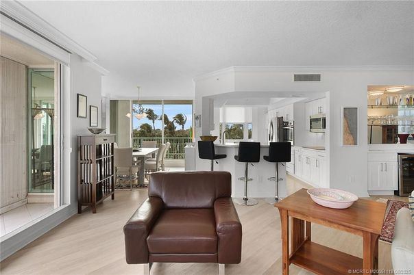 Chandelier, Dining room, Interior, Kitchen, Pendant Lights, Stainless Steel Appliances, Wood Texture Flooring