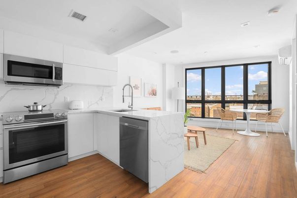 Dining room, Interior, Kitchen, Marble Walls, Recessed Lighting, Stainless Steel Appliances, Wood Texture Flooring