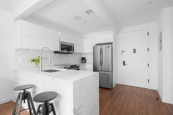 Interior, Kitchen, Marble Walls, Recessed Lighting, Stainless Steel Appliances, Wood Texture Flooring