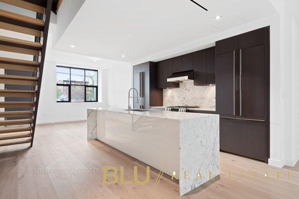 Interior, Kitchen, Marble Walls, Recessed Lighting, Stainless Steel Appliances, Wood Texture Flooring