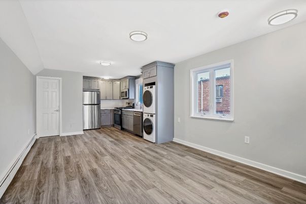 Interior, Kitchen, Recessed Lighting, Stainless Steel Appliances, Washer, Wood Texture Flooring