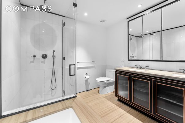 Bathroom, Dual Sink Vanities, Glass Shower, Interior, Recessed Lighting, Wood Texture Flooring