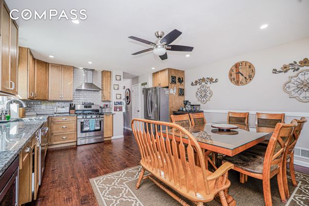 Dining room, Interior, Kitchen, Recessed Lighting, Stainless Steel Appliances, Wood Texture Flooring