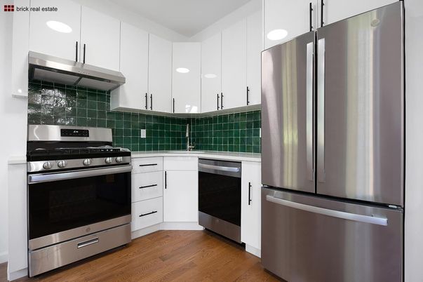 Interior, Kitchen, Stainless Steel Appliances, Tile Countertops, Wood Texture Flooring