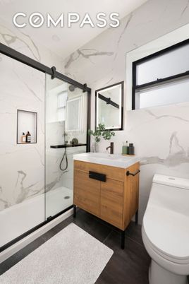 Bathroom, Glass Shower, Interior, Marble Walls, Wood Texture Flooring