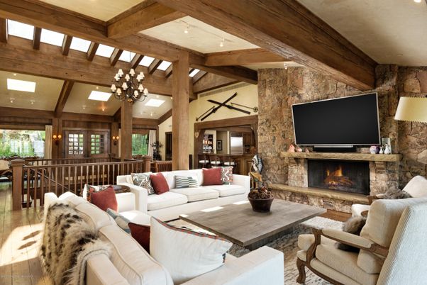 Chandelier, Fireplace, Interior, Living room, Recessed Lighting, Stone Walls, Wooden Beams, Wood Texture Flooring
