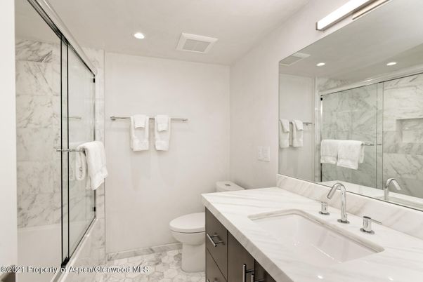 Bathroom, Dual Sink Vanities, Glass Shower, Interior, Marble, Marble Walls, Recessed Lighting