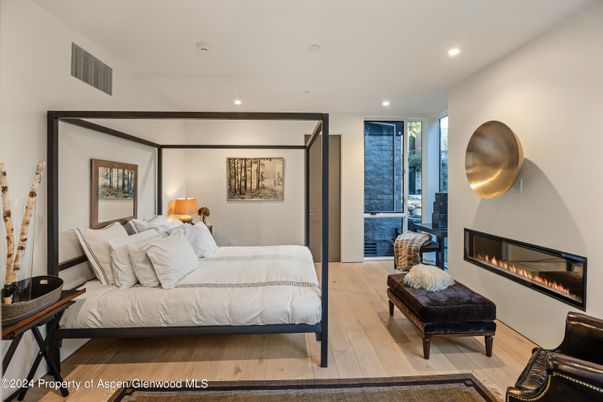 Bedroom, Fireplace, Interior, Recessed Lighting, Wood Texture Flooring