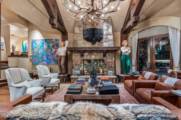 Chandelier, Fireplace, Interior, Living room, Recessed Lighting, Stone Walls, Wooden Beams, Wood Texture Flooring