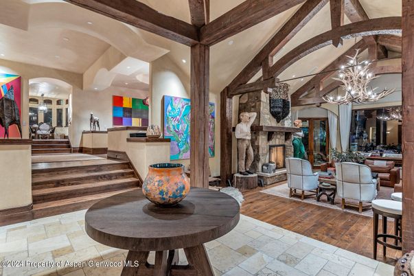 Chandelier, Dining room, Fireplace, Interior, Living room, Pendant Lights, Recessed Lighting, Wooden Beams, Wood Texture Flooring