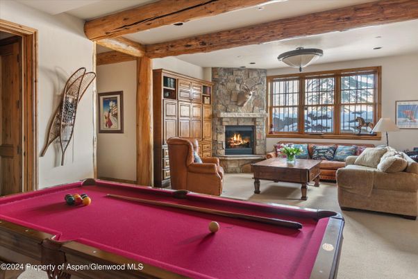 Billiard Table, Fireplace, Game Room, Interior, Living room, Recessed Lighting, Stone Walls, Wooden Beams