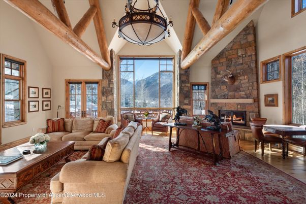Dining room, Fireplace, Interior, Living room, Pendant Lights, Stone Walls, Wooden Beams, Wood Texture Flooring