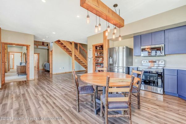 Dining room, Interior, Kitchen, Pendant Lights, Recessed Lighting, Stainless Steel Appliances, Wood Texture Flooring