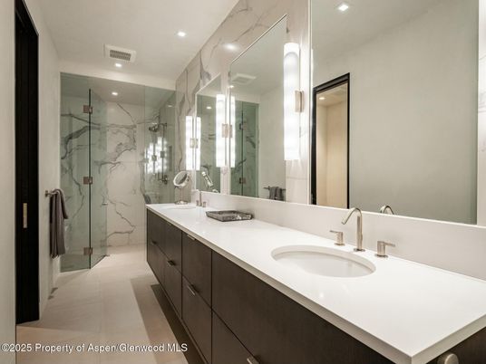 Bathroom, Dual Sink Vanities, Glass Shower, Interior, Marble Walls, Recessed Lighting