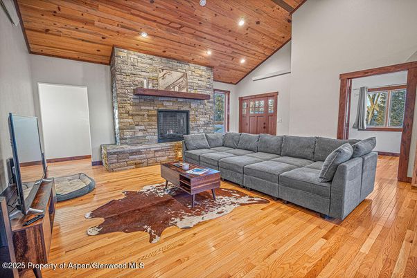 Fireplace, Interior, Living room, Recessed Lighting, Stone Walls, Wooden Ceilings, Wood Texture Flooring