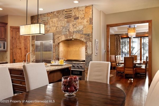 Dining room, Interior, Kitchen, Pendant Lights, Recessed Lighting, Stainless Steel Appliances, Stone Walls, Wood Texture Flooring