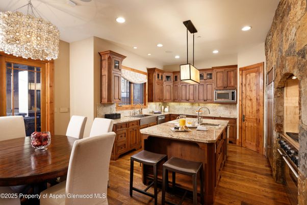 Dining room, Interior, Kitchen, Pendant Lights, Recessed Lighting, Stainless Steel Appliances, Stone Walls, Wood Texture Flooring