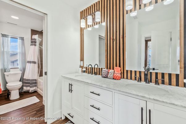 Bathroom, Dual Sink Vanities, Interior, Recessed Lighting, Wood Texture Flooring