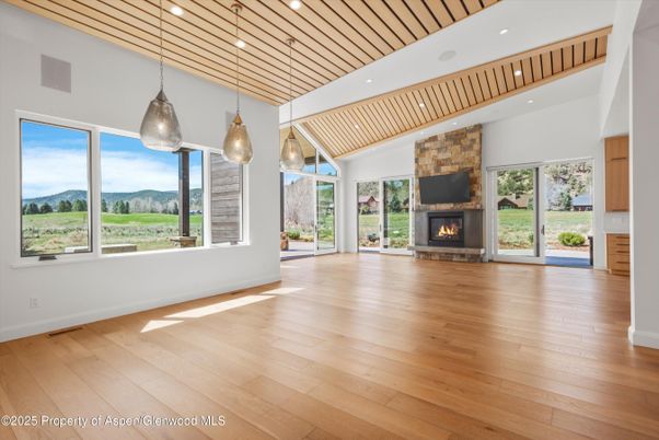 Empty room, Fireplace, Interior, Pendant Lights, Recessed Lighting, Wood Texture Flooring