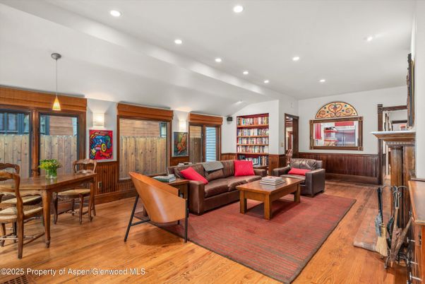 Dining room, Fireplace, Interior, Living room, Pendant Lights, Recessed Lighting, Wood Texture Flooring