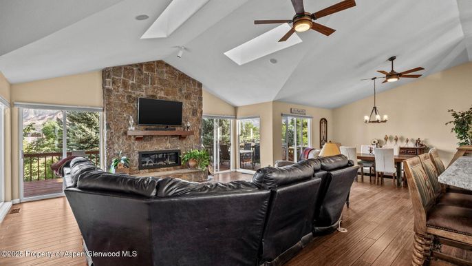 Chandelier, Dining room, Fireplace, Interior, Living room, Stone Walls, Wood Texture Flooring