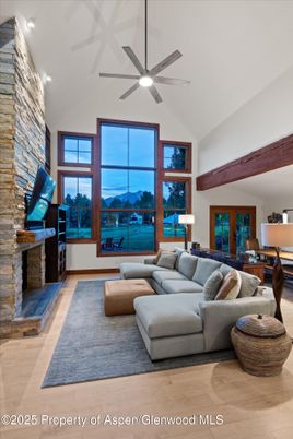 Dining room, Fireplace, Interior, Living room, Recessed Lighting, Stone Walls, Wood Texture Flooring