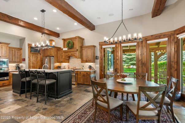 Chandelier, Dining room, Interior, Kitchen, Pendant Lights, Recessed Lighting, Stainless Steel Appliances, Wooden Beams, Wood Texture Flooring