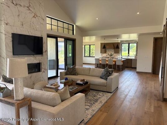 Dining room, Interior, Kitchen, Living room, Marble Walls, Pendant Lights, Recessed Lighting, Wood Texture Flooring