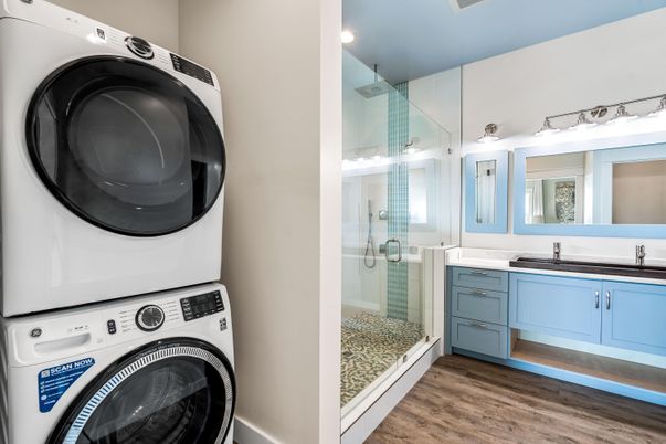 Bathroom, Glass Shower, Interior, Recessed Lighting, Washer, Wood Texture Flooring