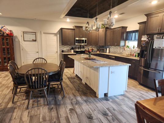 Chandelier, Dining room, Interior, Kitchen, Pendant Lights, Recessed Lighting, Stainless Steel Appliances, Wood Texture Flooring