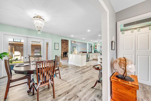 Chandelier, Dining room, Fireplace, Interior, Kitchen, Recessed Lighting, Stone Walls, Wood Texture Flooring