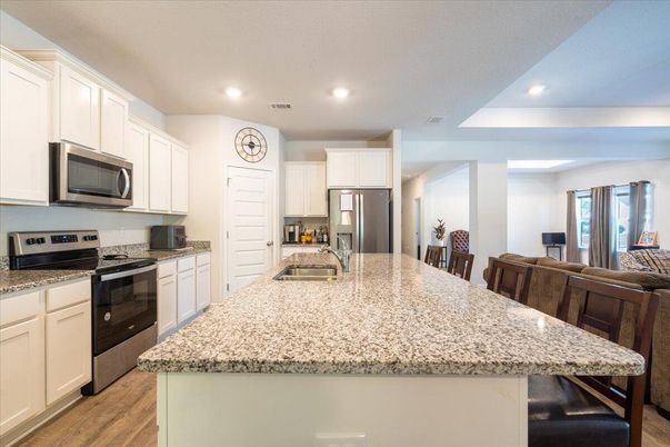 Dining room, Interior, Kitchen, Recessed Lighting, Stainless Steel Appliances, Wood Texture Flooring