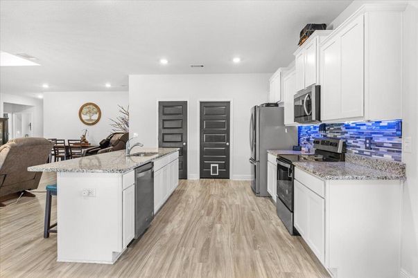 Dining room, Interior, Kitchen, Recessed Lighting, Stainless Steel Appliances, Wood Texture Flooring