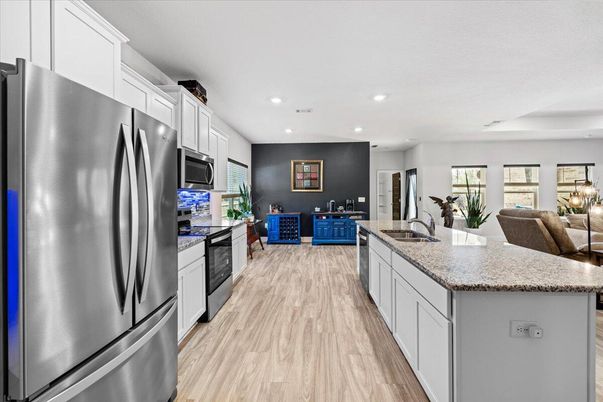 Dining room, Interior, Kitchen, Recessed Lighting, Stainless Steel Appliances, Wood Texture Flooring