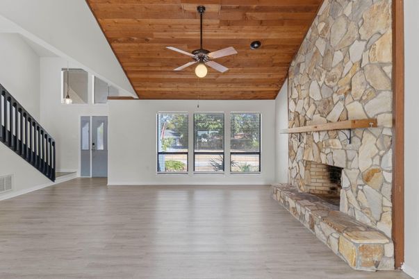 Empty room, Fireplace, Interior, Stone Walls, Wooden Ceilings, Wood Texture Flooring