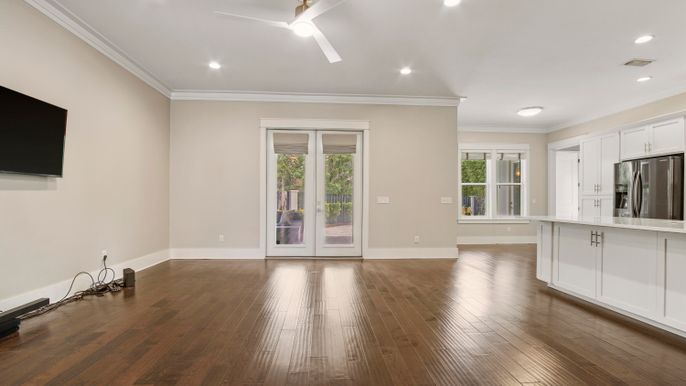 Empty room, Interior, Kitchen, Recessed Lighting, Stainless Steel Appliances, Wood Texture Flooring