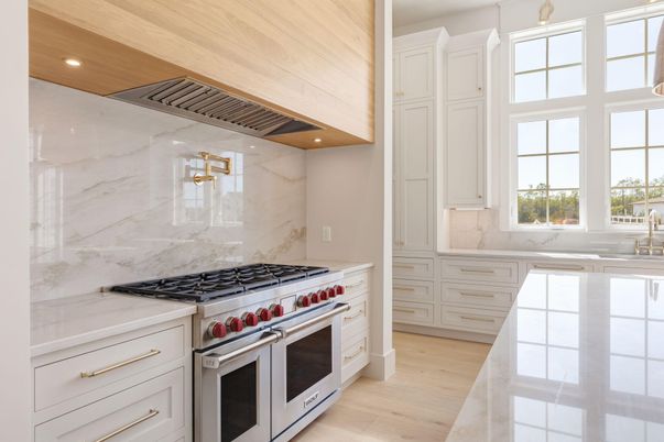Interior, Kitchen, Marble Walls, Recessed Lighting, Stainless Steel Appliances, Wood Texture Flooring