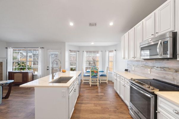 Dining room, Interior, Kitchen, Recessed Lighting, Stainless Steel Appliances, Wood Texture Flooring